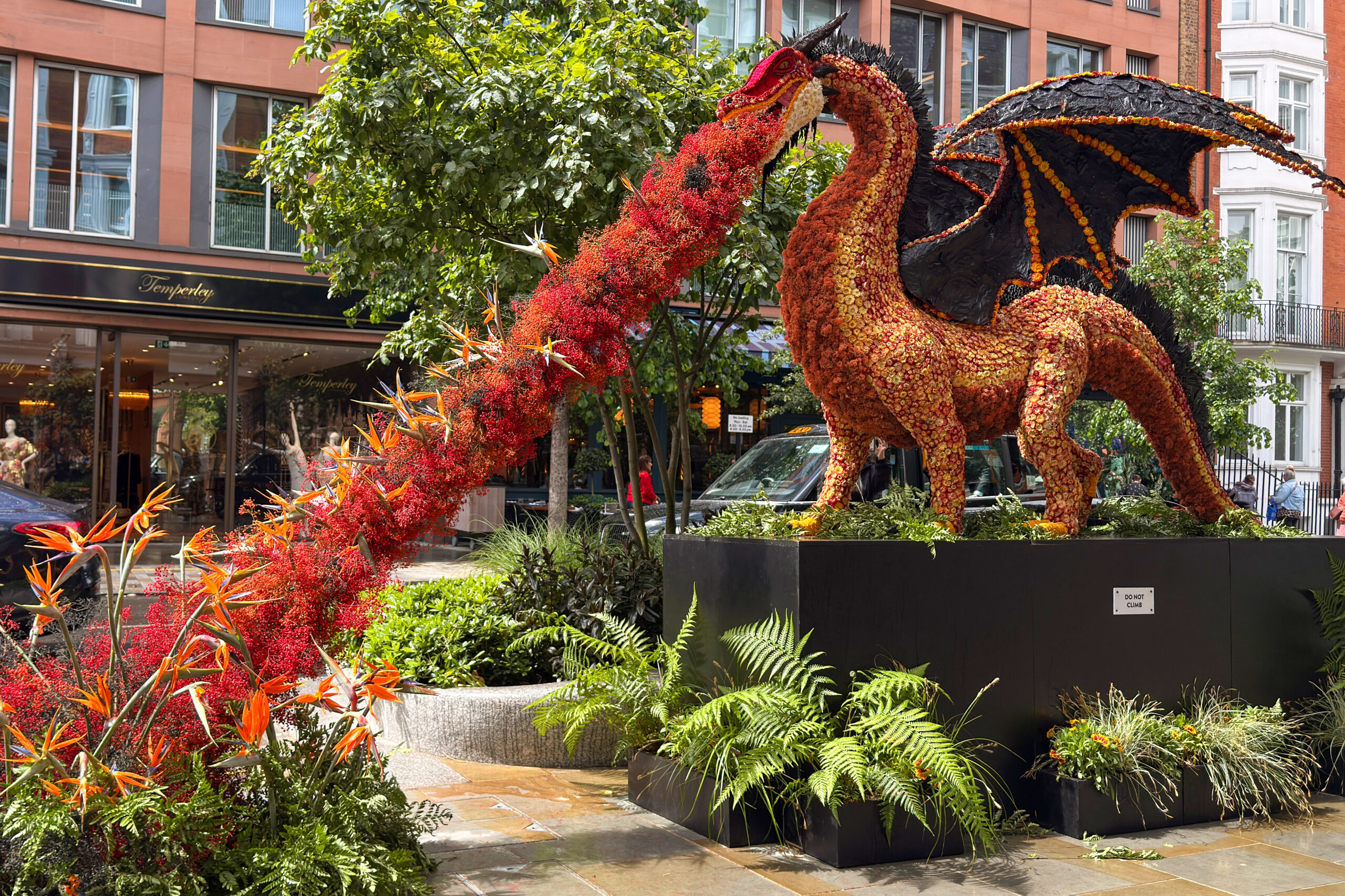 Floral dragon installation at Chelsea in Bloom 2026 demonstrating experiential retail storytelling