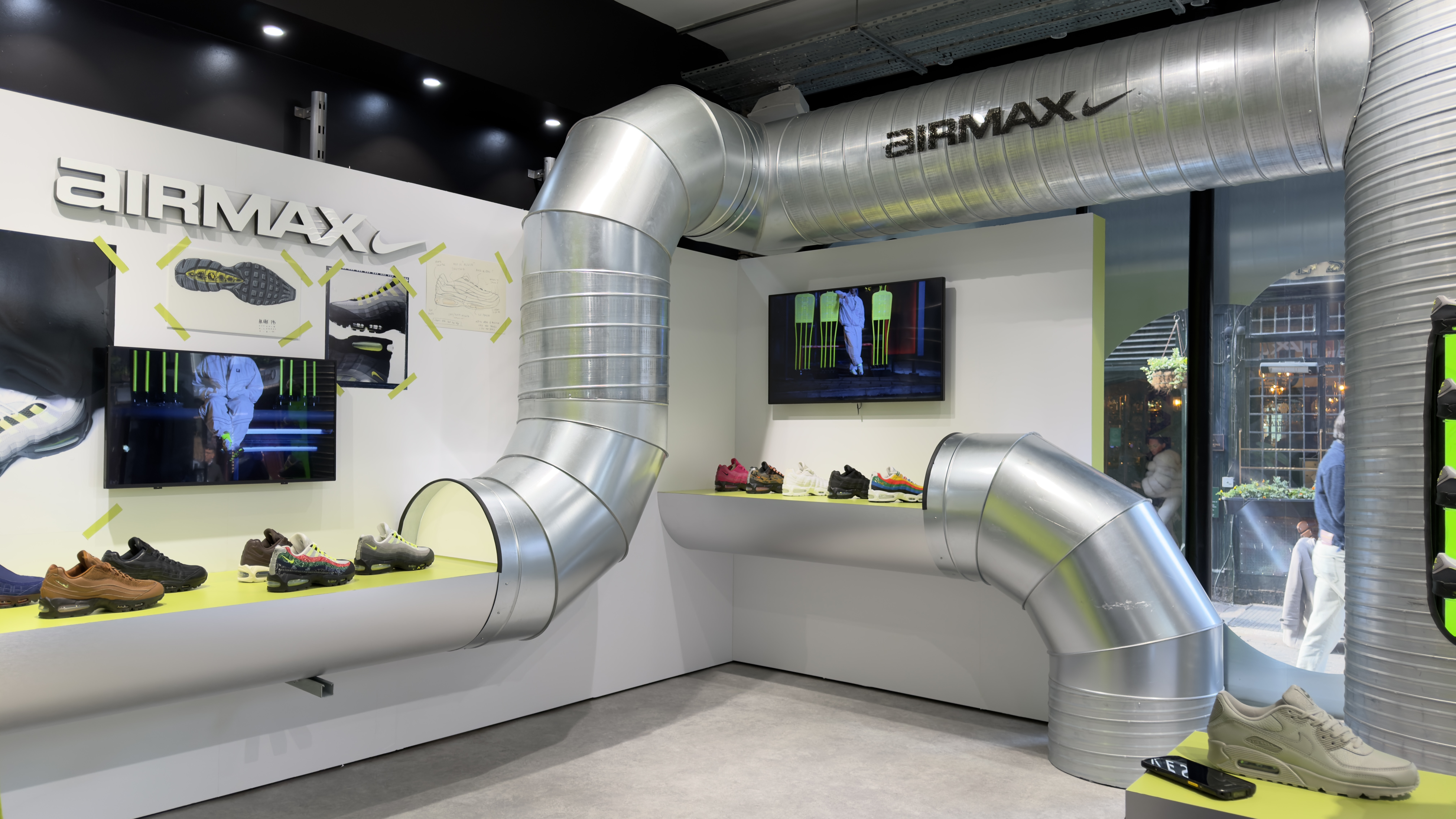 Nike experiential retail installation with industrial materials and exhibition-inspired merchandising