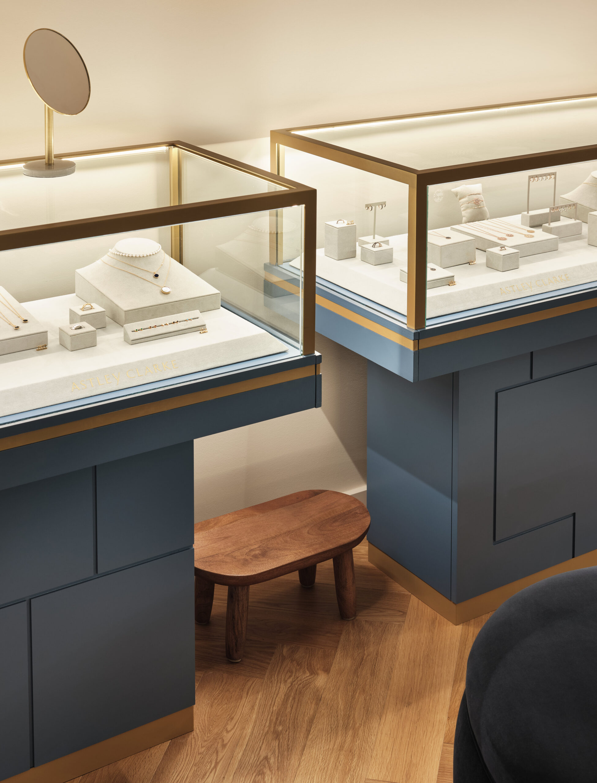 Bespoke illuminated jewellery display cabinets showcasing Astley Clarke collections with integrated LED lighting and premium materials.