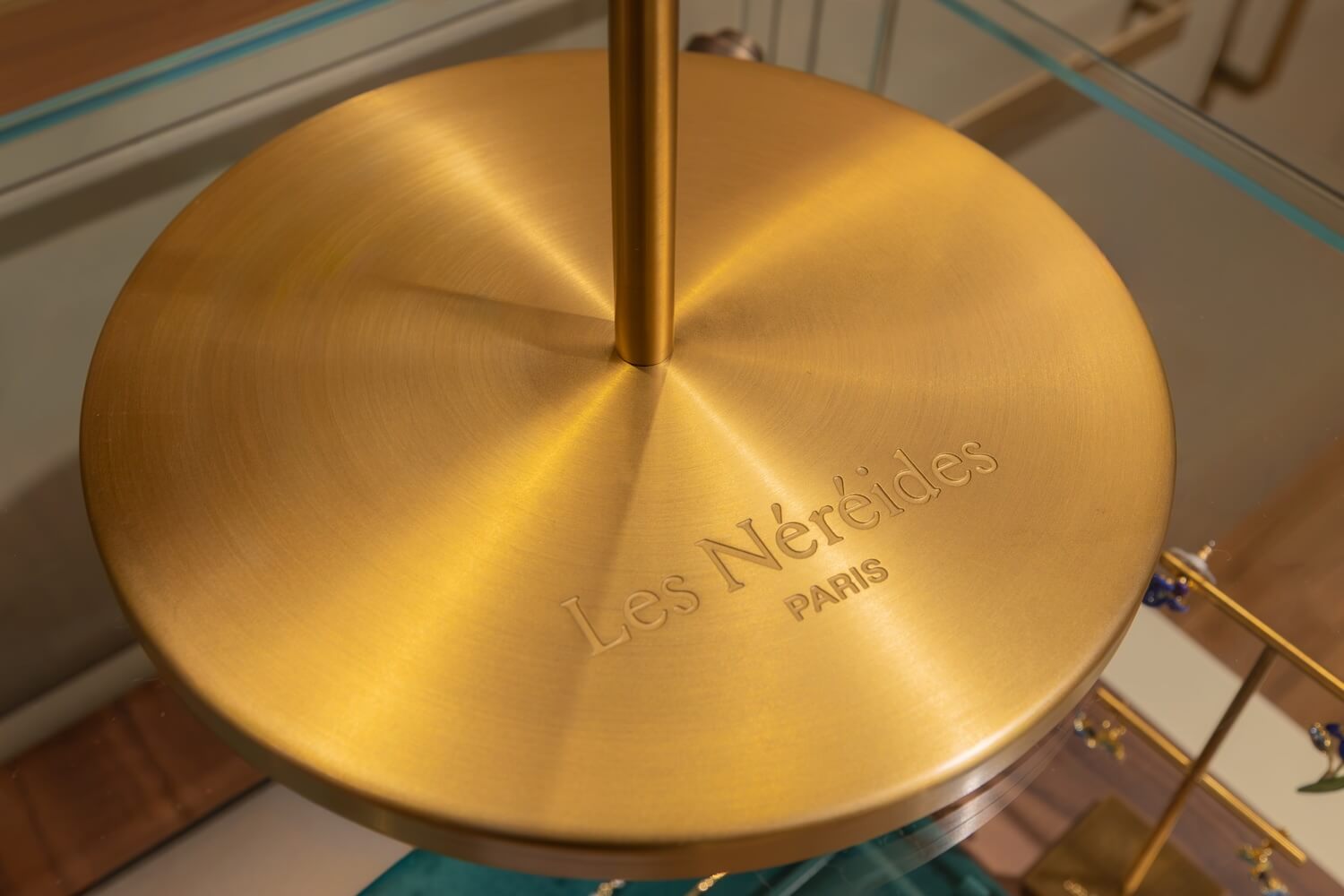 Les Nereides branded stand